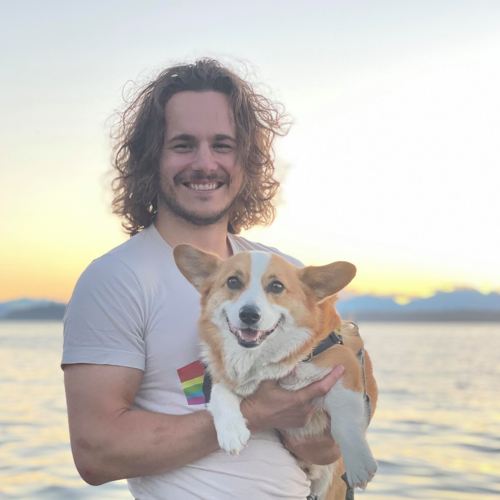 Grant holding Sampson at sunset overlooking Puget Sound